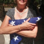 holding-the-flag-from-my-dads-casket